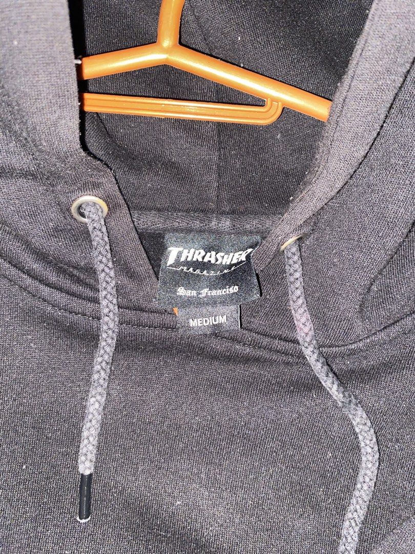 Thrasher Flame Logo Black Hoodie Medium (Category: Hoodies) located in Bauan. Submitted by oneiasan (Listing ID 1470856553, Image 3). Description: - Brand/Model: Thrasher Magazine Hoodie - Color: Black - Size: Medium - Design: Iconic blue/red flame logo on sleeve, small chest print - Features: Soft fleece interior, drawstring hood, front kangaroo pocket - Condition: Worn a few times, excellent shape, clean and ready to wear - Note: DM for exact m
