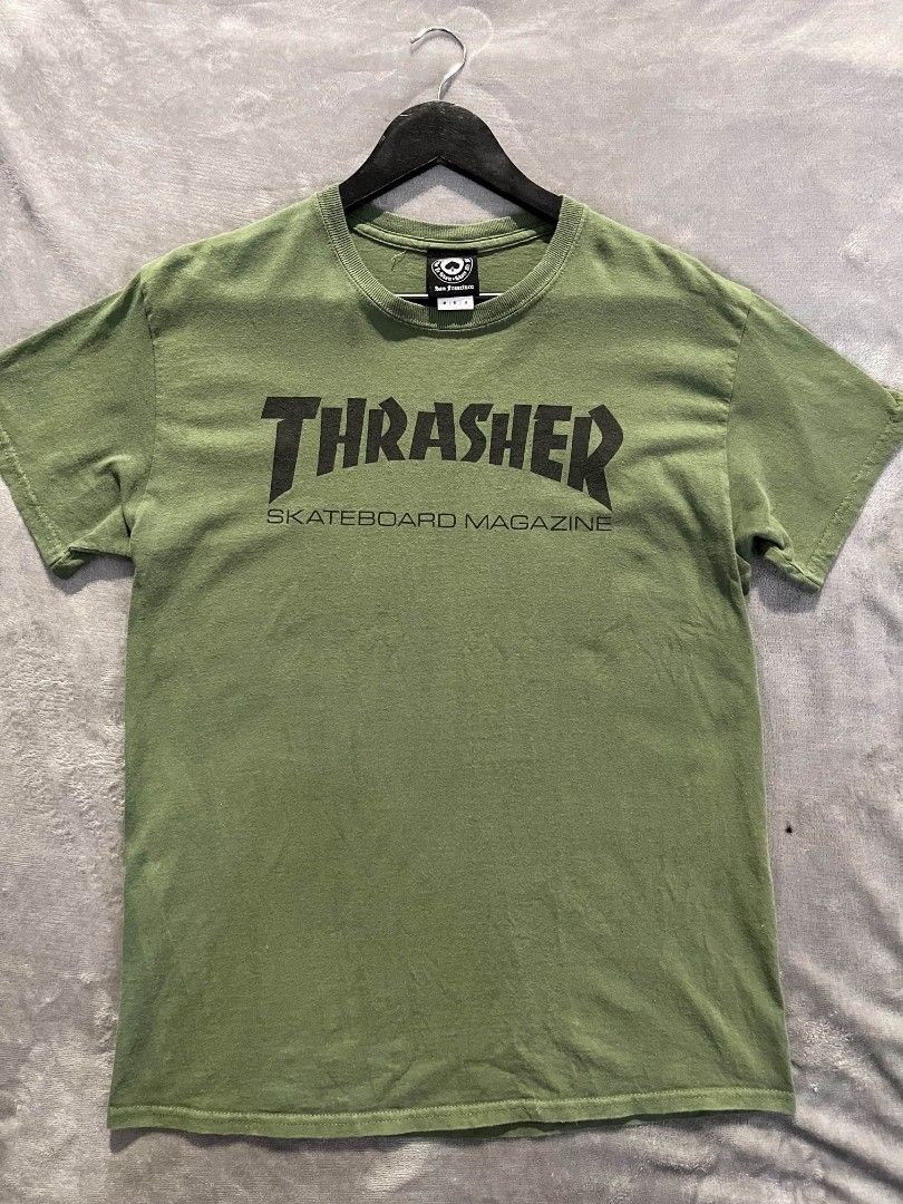 Thrasher Skate Mag T-shirt (Category: Activewear) located in Manila. Submitted by zenwind_3cdc42 (Listing ID 1470816910, Image 1). Description: Thrasher Skate Mag T-Shirt Army Green • Pre-shrunk cotton • Very Good Condition 9/10 • Dimension 28x19.5 { Medium } • Ship via j&t // flash DM me to claim.