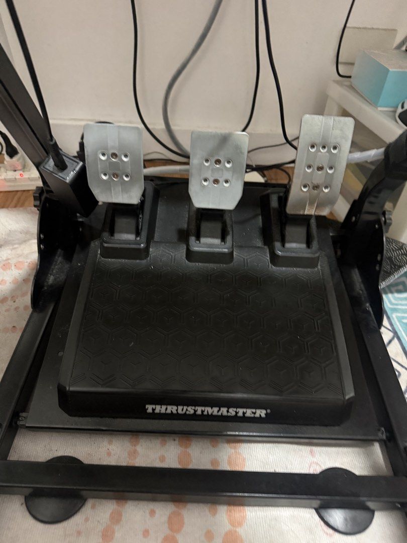 Thrustmaster T248 Racing Wheel and Pedals with Stand (Category: Controllers) located in Quezon City. Submitted by brightstartech1029 (Listing ID 1470890153, Image 3). Description: - Thrustmaster T248 racing wheel and pedal bundle - Includes heavy-duty metal stand and gear shifter plate attachment - Three responsive metal pedals included - Force feedback wheel with built-in display panel and multiple button configs - Fully wired with power supply 