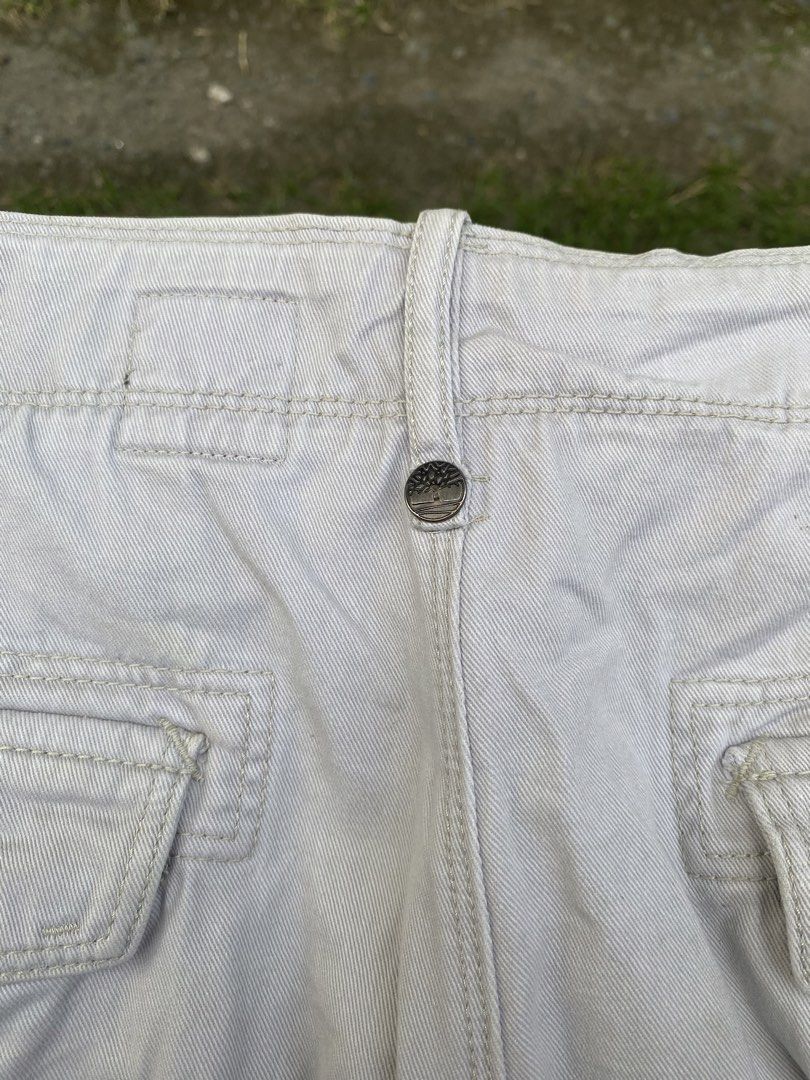 Timberland Cargo Shorts Off-White Size 36 (Category: Shorts) located in Imus. Submitted by frootiloots4103 (Listing ID 1470770555, Image 3). Description: - Brand: Timberland - Color: Off-White - Size: 36 Waist (12-inch inseam, 22-inch length) - Material: 100% durable cotton twill - Features: Classic multi-pocket cargo design, button and zipper fly, iconic embroidered tree logo on the back pocket - Origin: Made in Bangladesh - Condition: Excellent