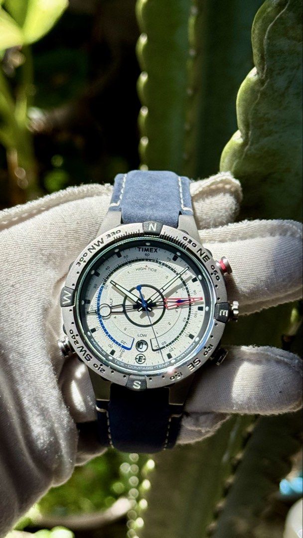 Timex Tide Compass Temp Watch Blue Leather Strap (Category: Men's Watches) located in Manila. Submitted by junjun12356 (Listing ID 1470882308, Image 1). Description: - Model: Timex Tide Compass Temp quartz watch - Material: Durable stainless steel case with a stylish blue leather strap - Display: Multi-functional dial showing tide levels, compass directions, and thermometer readings - Condition: Clean crystal, functional bezel, and multiple worki