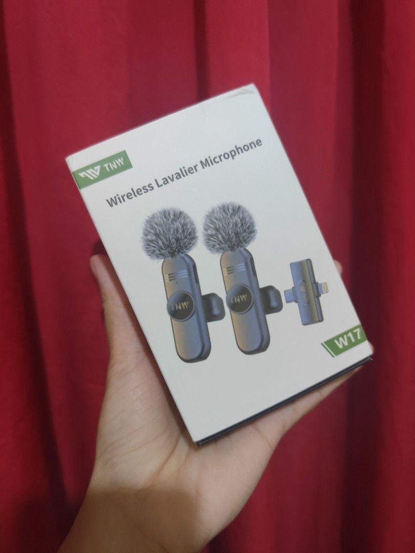 TNW W17 Wireless Lavalier Microphone Dual Mic Set (Category: Microphones) located in Quezon City. Submitted by dalloved (Listing ID 1470825115, Image 2). Description: - Model: TNW W17 wireless lavalier microphone system - Condition: Ready to use with original packaging box included - Setup: Dual mic system with sleek black transmitters and receiver - Connectivity: Includes both Lightning and Type-C connectors - Extras: Built-in charging cable com