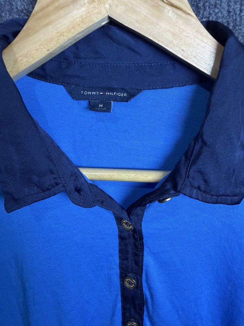 Tommy Hilfiger Blue Polo Shirt (Category: Blouses) located in Baguio. Submitted by thriftcoded_2600 (Listing ID 1470863722, Image 1). Description: - Brand: Tommy Hilfiger - Size: M - Excellent Condition Needs wash - Authentic - 18x26.