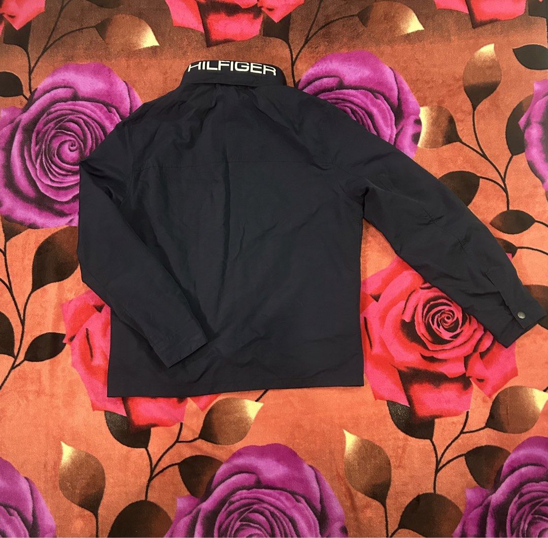 TOMMY HILFIGER PACKABLE HOOD WINDBREAKER JACKET (Category: Coats, Jackets and Outerwear) located in Dasmarinas. Submitted by dnnr3rdyyyyy (Listing ID 1470821499, Image 3). Description: Dimensions 23 Width 27 Length Size medium on tags Good as new condition 9.5/10 color rate Minimal Issues All goods Zipper & Buttons Authentic/Legit Navy Blue Color .