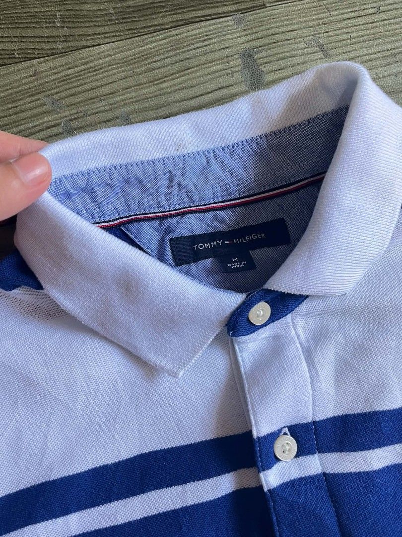 Tommy Hilfiger strip polonshirt (Category: Tshirts & Polo Shirts ) located in Manila. Submitted by samson033 (Listing ID 1470828899, Image 2). Description: Tommy Hilfiger polo shirt Measurements: • Width 20” | Length 27” • Size: medium on tag • Color Rate: 10/10 • Condition: Excellent • Issue: Stain washable.