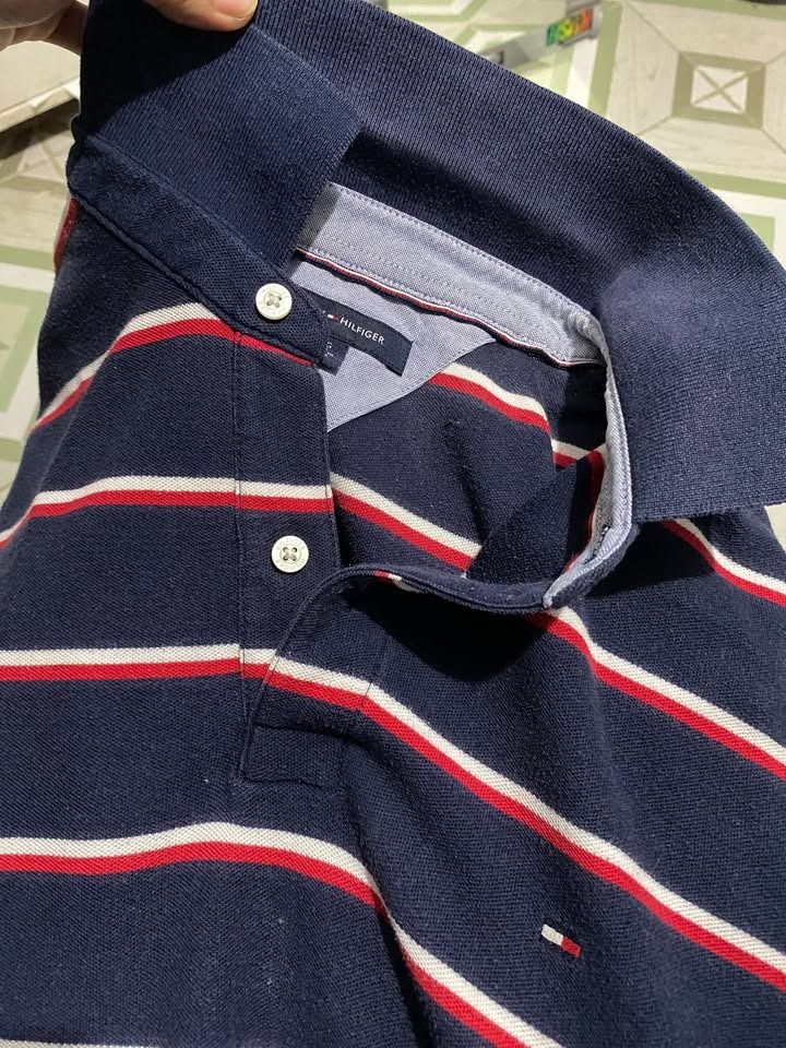 Tommy hilfiger stripes (Category: Tshirts & Polo Shirts ) located in Caloocan City. Submitted by lthrifts993 (Listing ID 1470849279, Image 3). Description: Tommy hilfiger stripes 22x27.5 Color rate: 9/10 Issue: None.