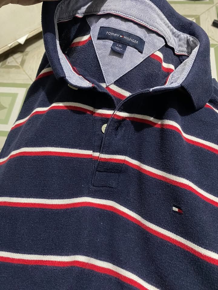 Tommy hilfiger stripes (Category: Tshirts & Polo Shirts ) located in Caloocan City. Submitted by lthrifts993 (Listing ID 1470849279, Image 2). Description: Tommy hilfiger stripes 22x27.5 Color rate: 9/10 Issue: None.