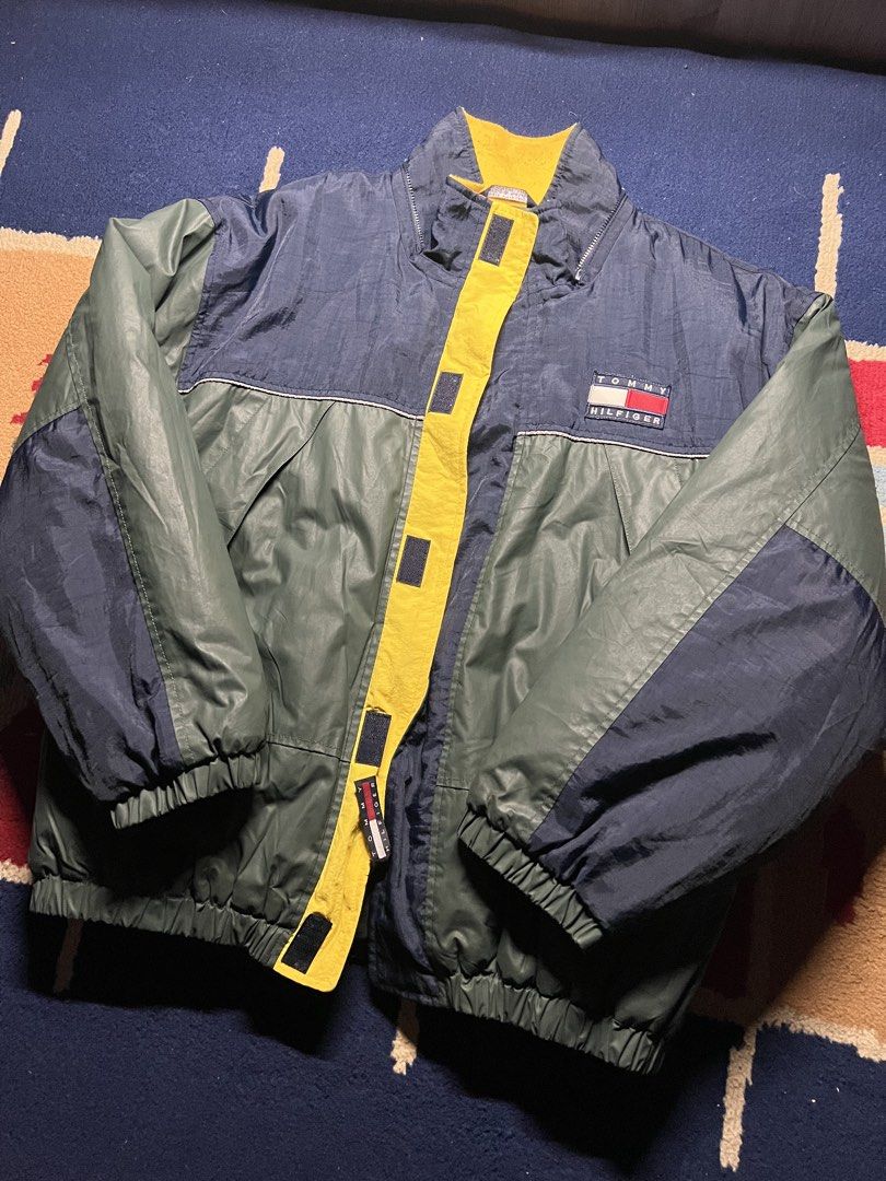 Tommy Hilfiger Vintage 90s Puffer Jacket (Category: Coats, Jackets and Outerwear) located in Pasig City. Submitted by downlowtooslow (Listing ID 1470877813, Image 2). Description: Vintage Tommy Hilfiger Colorblock PufferJacket 22 width 26 length - Classic Tommy Hilfiger embroidered chest logo - Full-zip design with a bold yellow front closure.