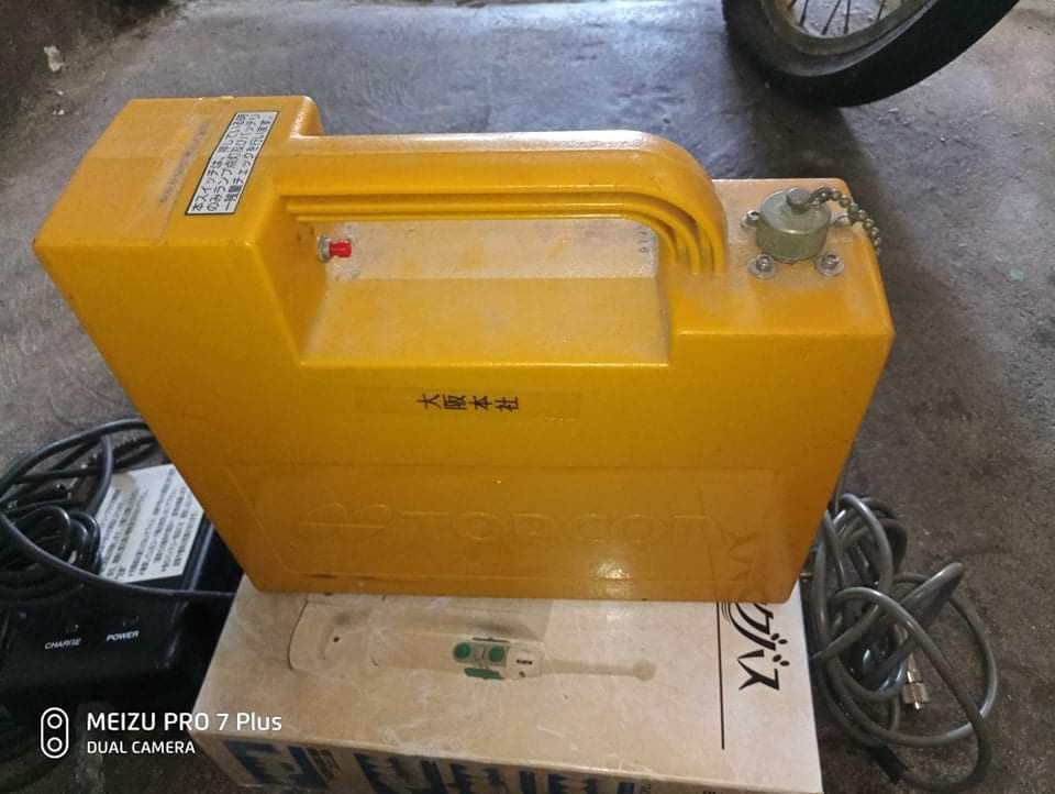 Topcon Battery with Battery Charger Model BVW1225 (Category: Construction Tools & Equipment) located in Taguig. Submitted by grandfish_55ab5c (Listing ID 1470928803, Image 1). Description: - Brand/Model: Yellow Topcon rechargeable battery unit - Type: Lead-acid battery setup with a convenient built-in handle - Included: Ault Inc battery charger (Model BVW1225) and connecting cables - Charger Specs: Input 100-240V, Output 14.7V - Additional Info: 