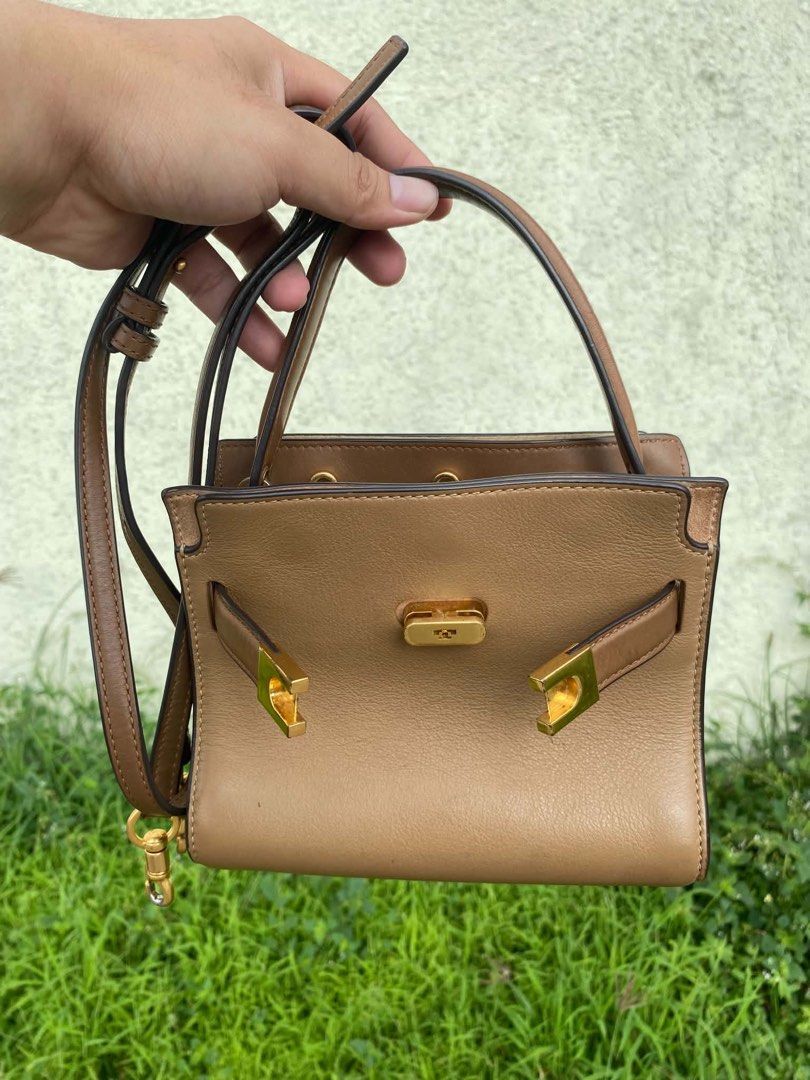 Tory Burch Petite Lee Radziwill Double Bag Aged Tan (Category: Luxury Bags & Wallets) located in Manila. Submitted by sharmatine97049 (Listing ID 1470875706, Image 2). Description: Tory Burch Petite Lee Radziwill Double Bag in aged tan leather. Structured shape with signature lock hardware and top handle. Includes detachable shoulder strap. Gold-tone hardware details throughout. Interior features multiple compartments and card slots. Clean lining