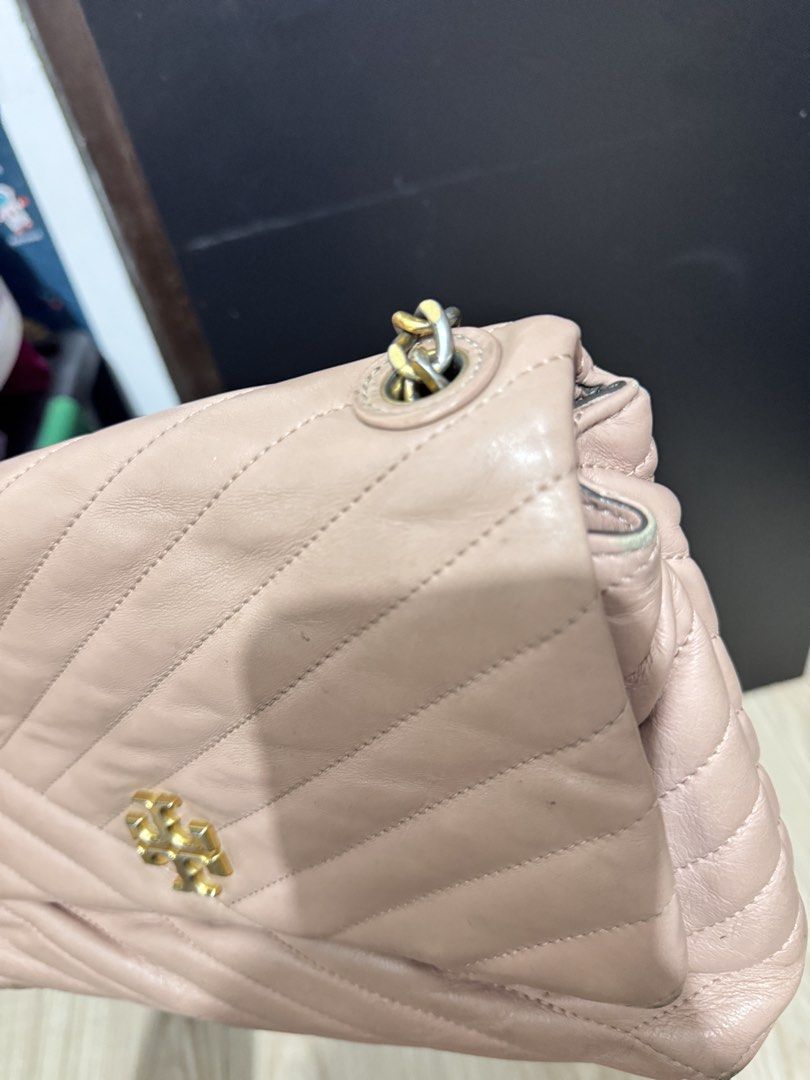 Tory Burch Quilted Pink Leather Shoulder Bag (Category: Luxury Bags & Wallets) located in Manila. Submitted by dearpinkcollections (Listing ID 1470847840, Image 3). Description: - Brand: Tory Burch - Material: Pink quilted leather with gold-tone hardware - Strap: Chain strap with comfortable leather shoulder section - Closure: Flap top with secure magnetic closure and signature T logo - Interior: Cream fabric lining with a zipped pocket and metal