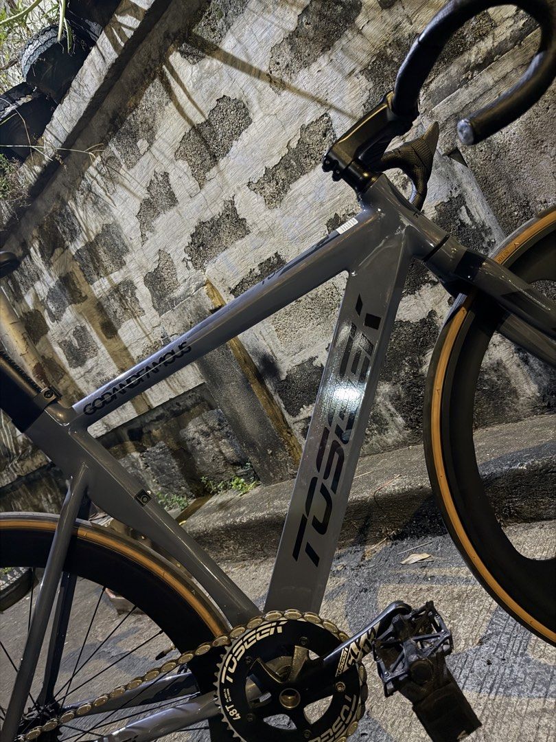 Toseek Fixed Gear Track Bike Grey (Category: Bicycles) located in Manila. Submitted by muchoc06 (Listing ID 1470900342, Image 2). Description: - Frame: Aero frame design with integrated seatpost in sleek grey - Wheelset: Front tri-spoke wheel matched with a rear deep dish wheel - Tires: Classic gumwall tires - Crankset: 48T Toseek crankset and chainring setup - Cockpit: Drop handlebars wrapped in clean black tape - Pedals: Ragusa pedals equipped 