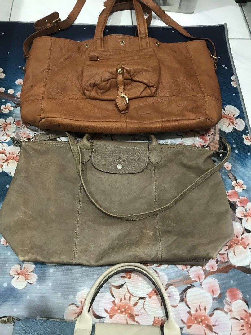 Tote bags bundle (Category: Tote Bags) located in Balete No 2. Submitted by troyesybang (Listing ID 1470785645, Image 3). Description: Longchamp. Salad All used some damages check postings Deets Bundle sale Sf to j&t NOT FOR SENSI BAWAL SA MASELAN available posted Crossed leather longchamp out not available not part of bundle 2 pcs salad tan cognac tote and blue lC msh only.