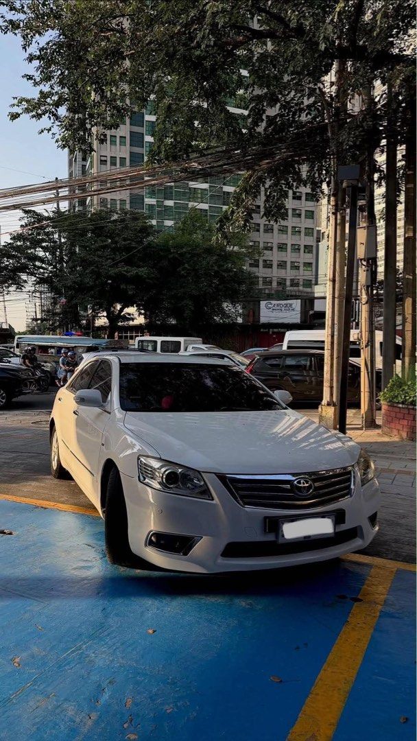 Toyota Camry 2.4 (A) (Category: Used Cars) located in Quezon City. Submitted by mariaanthea_n (Listing ID 1470833221, Image 2). Description: Toyota Camry 2.4G AT [2011] Inspected & Approved by 2Sog With INSURANCE ₱330,000 negotiable Specifications Engine: 2.4L 4-cylinder 2AZ-FE gasoline engine Transmission: 5-speed automatic Drivetrain: Front-wheel drive (FWD) Seating Capacity: 5 passengers Body Type: 4-door sedan Fuel: Unleaded gasoline Features