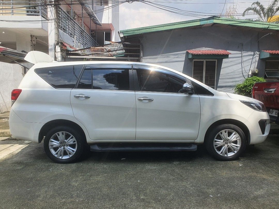 Toyota Innova (Category: Used Cars) located in Quezon City. Submitted by olxph_935890903 (Listing ID 1470764875, Image 2). Description: toyota innova v 2025 top of the line push start captain seat middle row intelligent door open all power window orig paint no repair ist owner spare key 3m tint daylight running light 17inches mags and tires 18k odo loc qc..west ave.