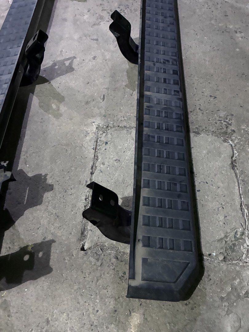 Toyota Prado Original Stepboard (Category: Body Parts and Accessories) located in Quezon City. Submitted by lopezbenj313596 (Listing ID 1470743935, Image 2). Description: Pair of original stepboards removed from a Toyota Prado after upgrading to a new set. Both stepboards feature a black finish, textured anti-slip stepping surfaces, and mounting brackets. * Vehicle: Toyota Land Cruiser Prado * Item: Side stepboards / running boards * Quantity: 2 