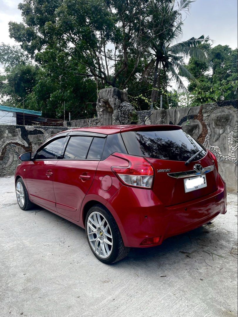 Toyota Yaris 1.3 (A) (Category: Used Cars) located in Makati City. Submitted by lg_sy (Listing ID 1470769753, Image 3). Description: Toyota Yaris E 1.3 2014 Gas Automatic Transmission 134,xxx odo Red Mica Metallic Plate ending 2 First owner Complete and clean papers Registered until Feb 2027 Cold aircondition Not flooded Slightly nego minor issues: scratches spot fading on spoiler part as is where is Upgrades: 17s VLF-38 silver mags worth ₱40k Ky