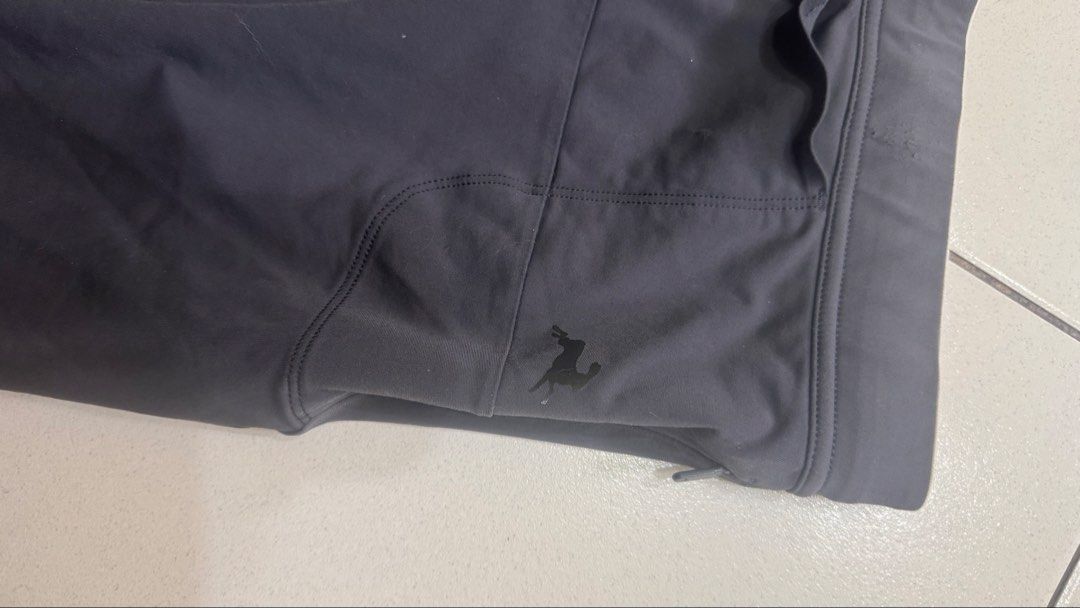 Tracksmith Half Tights (Category: Shorts) located in Caloocan City. Submitted by kennethsy1993 (Listing ID 1470782382, Image 3). Description: - Brand: Tracksmith New England - Color: Dark grey - Design: Woven patch logo on front hem and reflective rabbit logo near side pocket - Fit: Elastic waistband with adjustable drawstring - Storage: Multiple rear pockets for essentials - Condition: Excellent running shorts ready for use.