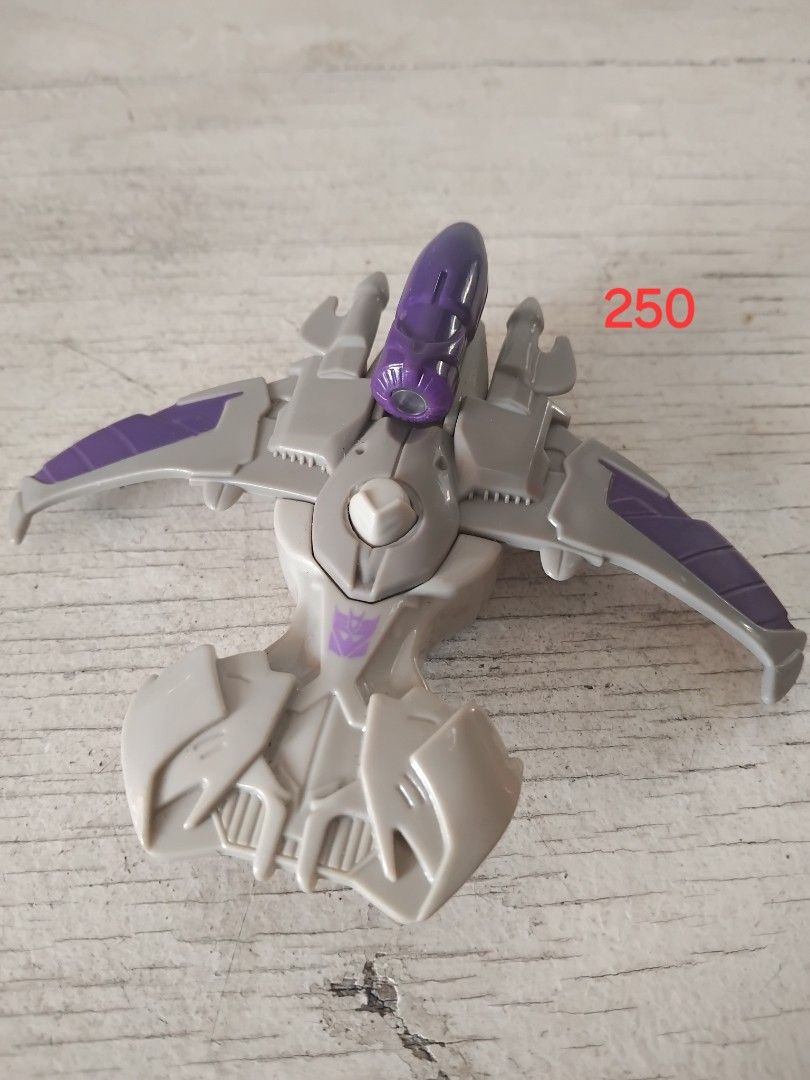Transformers Figures and Parts Lot (Category: Action & Battle Toys) located in San Fernando. Submitted by imlikeabird (Listing ID 1470749093, Image 2). Description: - Assorted Transformers figures and weapon parts - Features grey, orange, and purple colorways - Includes robot modes, vehicle mode jets, and plastic attachments - Various transformation stages represented - Ideal for collectors needing replacement bits or extra bots - Trusted Carouse