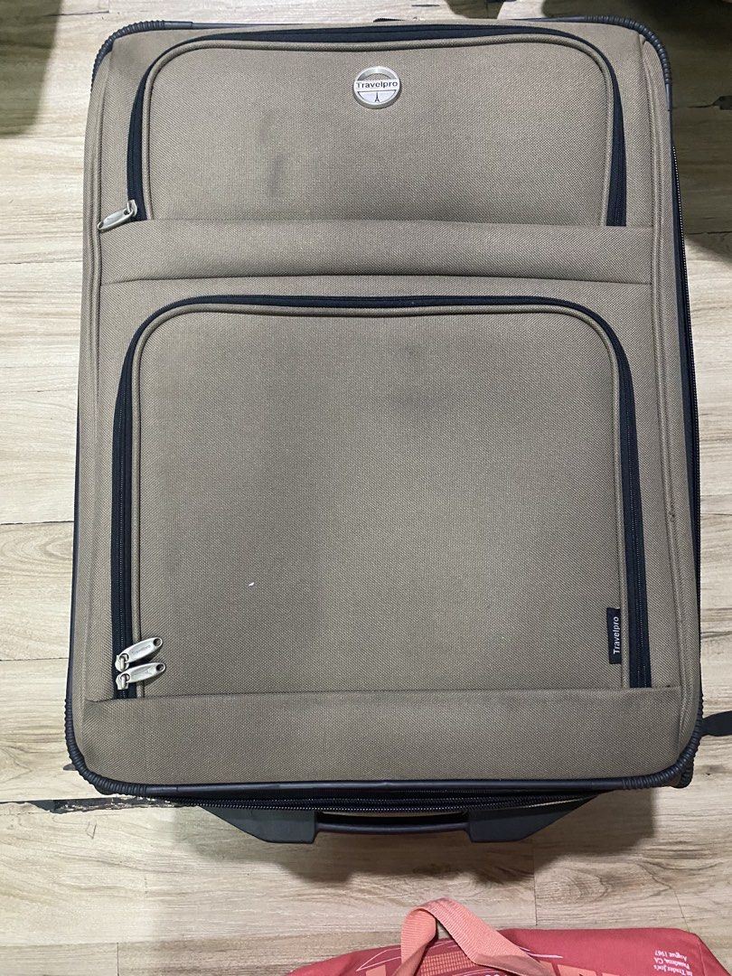 2pcs. Travelpro Luggage Suitcase (Category: Luggage) located in Makati City. Submitted by newdolphin.ef022f (Listing ID 1470765063, Image 3). Description: - Travelpro wheeled luggage in stylish tan/brown color - Includes a smaller matching bag nested inside for convenient packing - Durable fabric construction with protective strips along the back - Multiple exterior zipped pockets and heavy-duty zippers throughout - Solid top handle and a strap t