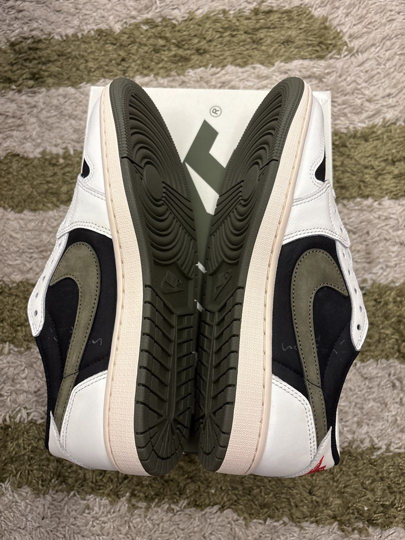 Travis Scott x Jordan 1 Low OG SP Olive (Category: Sneakers) located in Pasig City. Submitted by ripescobar (Listing ID 1470769097, Image 3). Description: - Model: Travis Scott x Jordan Brand Low Top - Colorway: Black, White, & Olive Green with iconic reverse swoosh - Details: Sail midsole, red Nike Air tongue branding, and Cactus Jack accents - Size: Women's US 10.5 (Mens US 9) - Condition: Brand new in original box - Inclusions: Complete with e