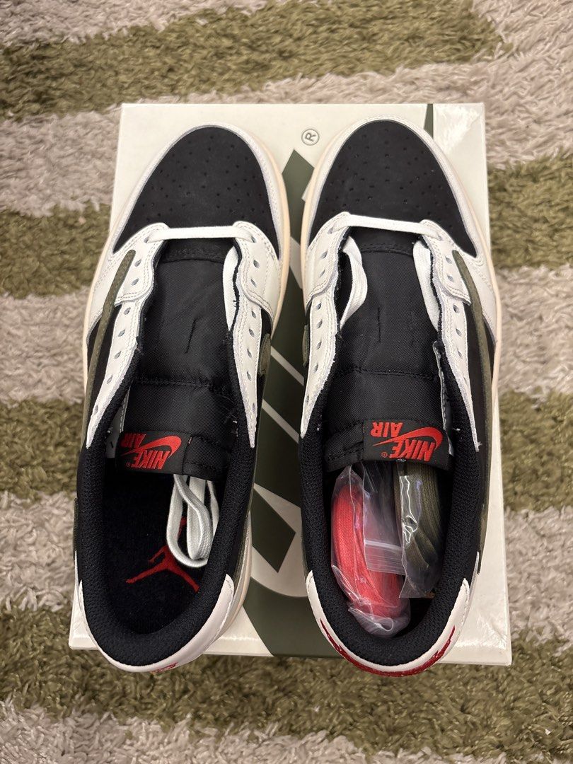 Travis Scott x Jordan 1 Low OG SP Olive (Category: Sneakers) located in Pasig City. Submitted by ripescobar (Listing ID 1470769097, Image 2). Description: - Model: Travis Scott x Jordan Brand Low Top - Colorway: Black, White, & Olive Green with iconic reverse swoosh - Details: Sail midsole, red Nike Air tongue branding, and Cactus Jack accents - Size: Women's US 10.5 (Mens US 9) - Condition: Brand new in original box - Inclusions: Complete with e