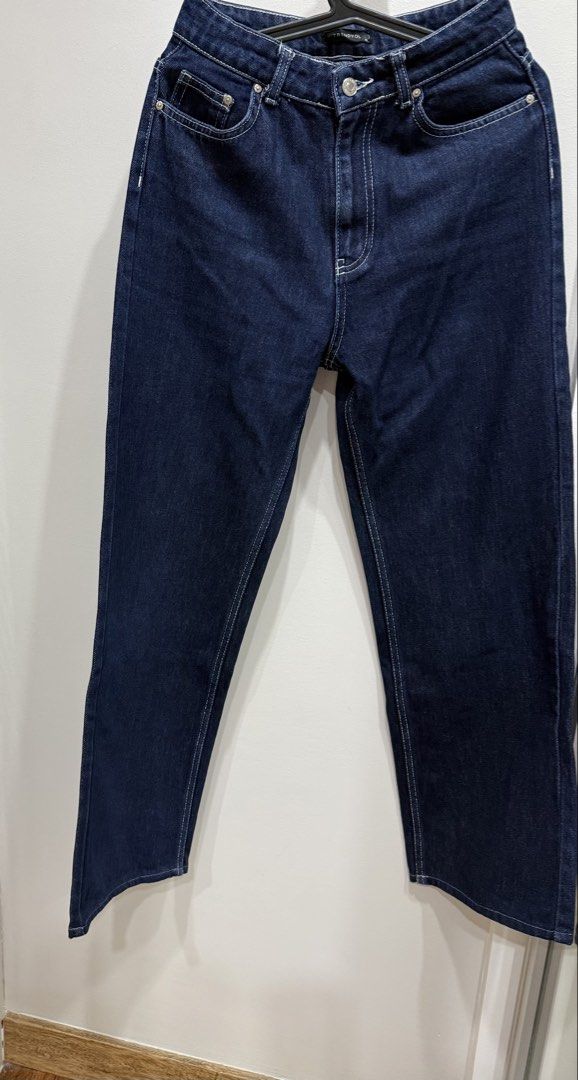Trendyol Dark Blue Denim Jeans Size 36 (Category: Jeans) located in Taguig. Submitted by bau375 (Listing ID 1470793457, Image 1). Description: - Brand: Trendyol - Size: 36 - Color: Dark blue denim with contrast white stitching - Fit: Classic straight leg - Details: Metal button closure with branding, standard five-pocket styling - Condition/Quality: Sturdy, durable fabric - Style: Versatile staple, easy to pair with tees or jackets.