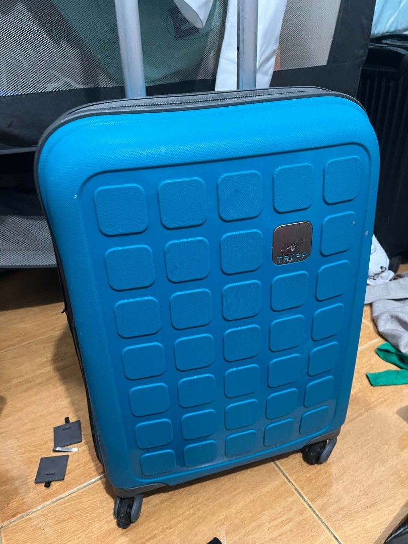 TAKE ALL - Tripp Suitcases Luggage Bundle Set (Category: Luggage) located in Paranaque City. Submitted by rjaymagdael (Listing ID 1470772192, Image 1). Description: - Bundle includes 3 Tripp suitcases - 1 bright blue hardshell trolley with wheels and extendable handle - 2 black luggage bags (1 softshell, 1 ribbed hardshell) - All feature the signature Tripp logo plaque - Condition: Used with minor dust and scuffs from past travels - Great value s