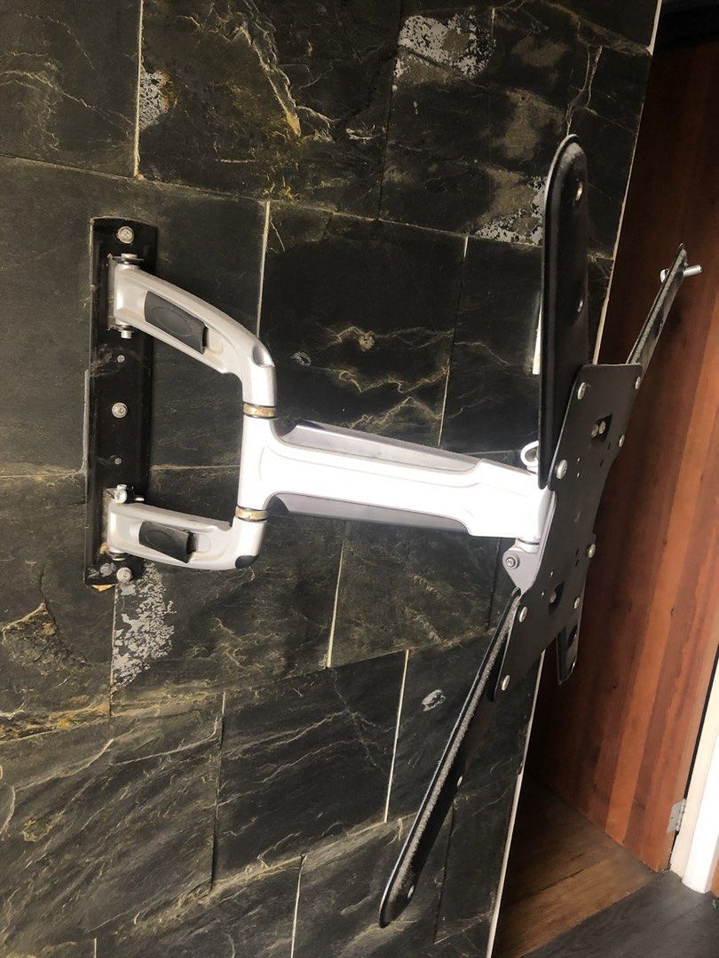 True Vision Full Motion Articulating TV Wall Mount Bracket (Category: TV Parts & Accessories) located in Del Monte. Submitted by jecramos (Listing ID 1470835195, Image 3). Description: - Brand: True Vision - Type: Heavy-duty articulating wall mount for flat screen TVs - Design: Dual-arm with a sleek silver and black finish - Adjustability: Extends, swivels, and tilts for the perfect viewing angle - Compatibility: Includes VESA mounting plate and 