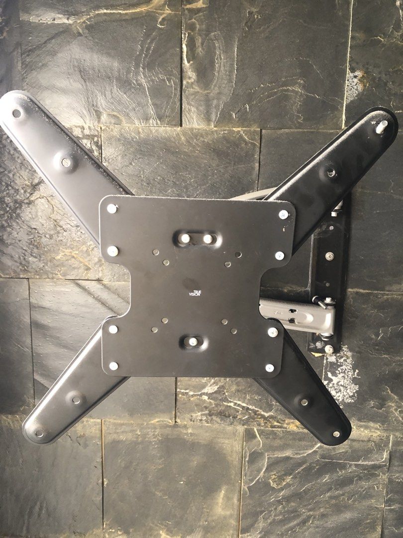 True Vision Full Motion Articulating TV Wall Mount Bracket (Category: TV Parts & Accessories) located in Del Monte. Submitted by jecramos (Listing ID 1470835195, Image 1). Description: - Brand: True Vision - Type: Heavy-duty articulating wall mount for flat screen TVs - Design: Dual-arm with a sleek silver and black finish - Adjustability: Extends, swivels, and tilts for the perfect viewing angle - Compatibility: Includes VESA mounting plate and 