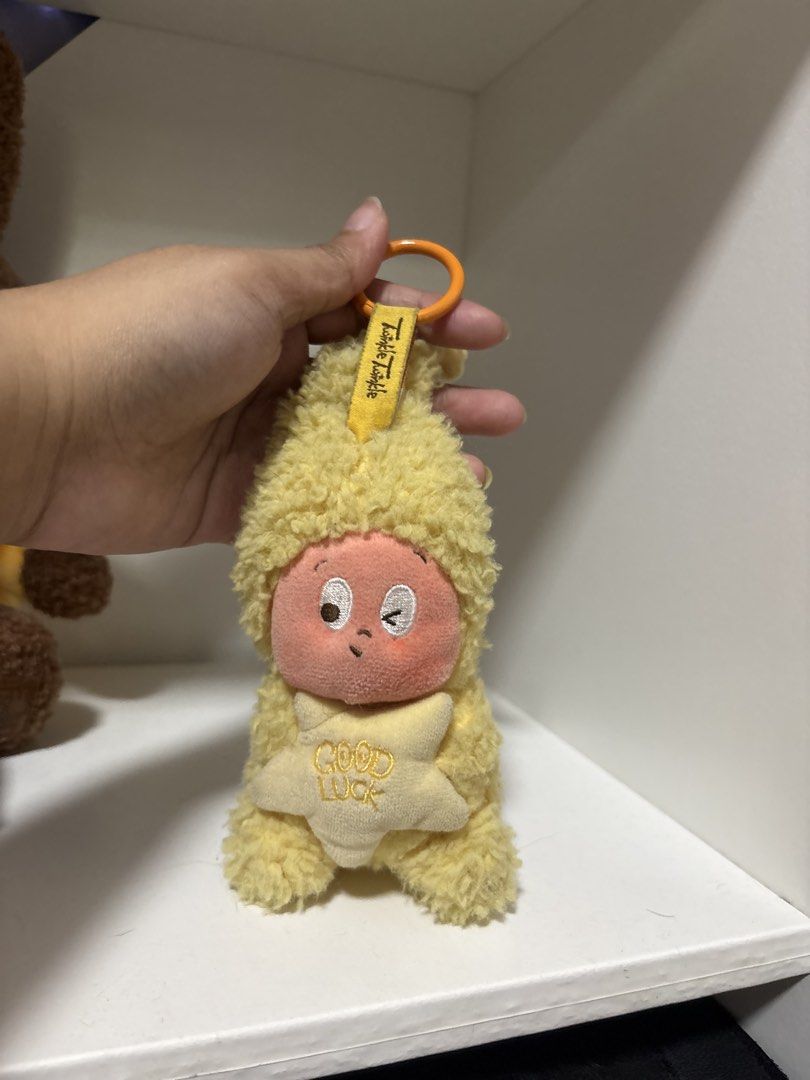 Twinkle Twinkle Yellow Star Plush Keychain (Category: Plushies & Soft Toys) located in Manila. Submitted by fritzha (Listing ID 1470864740, Image 1). Description: - Super soft yellow fuzzy plush toy featuring a matching yellow hood - Holding a cute star pillow embroidered with 'GOOD LUCK' - Adorable design with one open eye and one winking eye - Equipped with a 'Twinkle Twinkle' yellow ribbon loop at the top - Includes an orange plastic ring clip