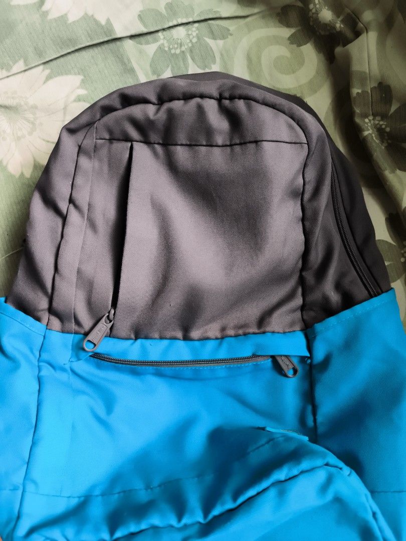 Two-tone Grey and Blue Casual Backpack with Multiple Pockets (Category: Backpacks) located in Bulacan. Submitted by jvblaguard08460 (Listing ID 1470750254, Image 2). Description: - Color: Grey and bright blue - Storage: Spacious main compartment with multiple interior slip pockets and an inner zippered pocket - Pockets: Front zippered pockets for quick access plus a hidden back zippered pocket for security - Comfort: Padded, adjustable shoulder s