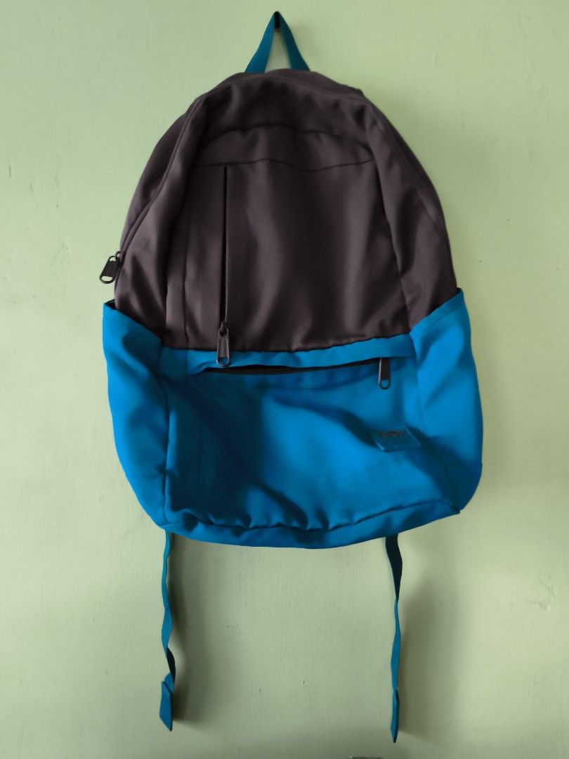 Two-tone Grey and Blue Casual Backpack with Multiple Pockets (Category: Backpacks) located in Bulacan. Submitted by jvblaguard08460 (Listing ID 1470750254, Image 1). Description: - Color: Grey and bright blue - Storage: Spacious main compartment with multiple interior slip pockets and an inner zippered pocket - Pockets: Front zippered pockets for quick access plus a hidden back zippered pocket for security - Comfort: Padded, adjustable shoulder s