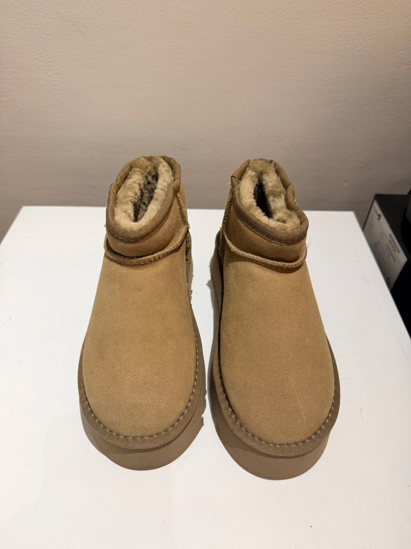 UGG Classic Ultra Mini Platform Chestnut Boots Size USA 7 (Category: Boots) located in Taytay. Submitted by chloweann (Listing ID 1470819834, Image 2). Description: - UGG Ultra Mini Platform Boots - Size: USA 7 / UK 5 / EU 38 - Color: Classic Chestnut - Material: Genuine suede upper with super soft, warm sheepskin lining - Sole: Thick platform sole with durable rugged tread - Details: Woven heel pull tab and iconic UGG leather patch on the back -