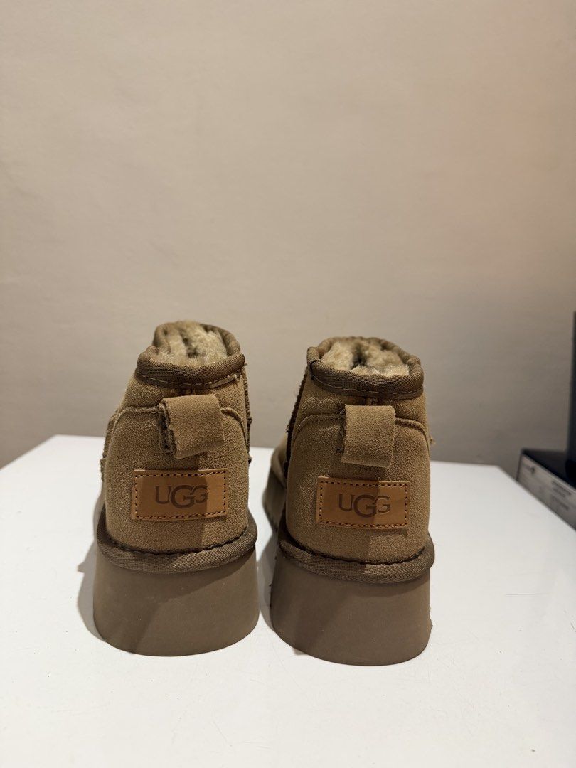 UGG Classic Ultra Mini Platform Chestnut Boots Size USA 7 (Category: Boots) located in Taytay. Submitted by chloweann (Listing ID 1470819834, Image 3). Description: - UGG Ultra Mini Platform Boots - Size: USA 7 / UK 5 / EU 38 - Color: Classic Chestnut - Material: Genuine suede upper with super soft, warm sheepskin lining - Sole: Thick platform sole with durable rugged tread - Details: Woven heel pull tab and iconic UGG leather patch on the back -