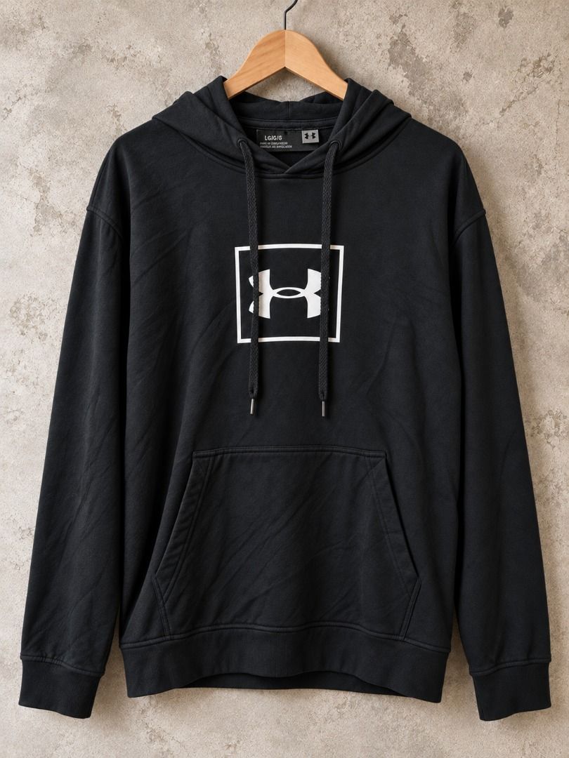 Under Armour Black Hoodie with Box Logo (Category: Hoodies) located in Caloocan City. Submitted by zealgem.7c9bb5 (Listing ID 1470901722, Image 1). Description: - Authentic Under Armour pullover hoodie in black - Striking white box logo printed on the chest - Adjustable hood with drawstrings - Practical front kangaroo pocket - Ribbed cuffs and hem for a snug fit - Standard fit, great for casual wear or workouts - Condition: Brand new / Excellent 