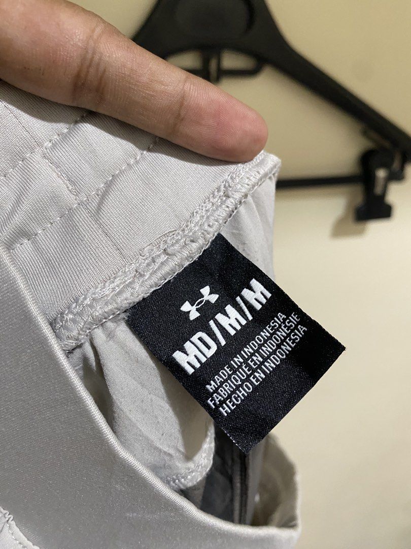 Under Armour Grey Orange Athletic Training Shorts Medium M (Category: Shorts) located in Cebu City. Submitted by theloose.thread (Listing ID 1470918055, Image 3). Description: - Brand: Under Armour - Condition: Excellent / Pre-loved - Size: MD - Color: Grey and dark charcoal - Pockets: Orange zipper pockets on front and back - Waistband: Elastic with adjustable patterned drawstring - Material: Lightweight and breathable - Ideal for: Workouts, gym