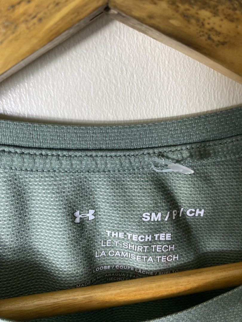 Under Armour The Tech Tee Green Small (Category: Activewear) located in Manila. Submitted by carbertjakosalem (Listing ID 1470921413, Image 2). Description: - Brand: Under Armour - Item: The Tech Tee - Color: Green - Size: Small - Fit: Loose fit with short sleeves and raglan seams - Logos: Small UA logo on chest and back collar - Material: 100% lightweight polyester - Ideal for: Workouts or casual everyday wear.
