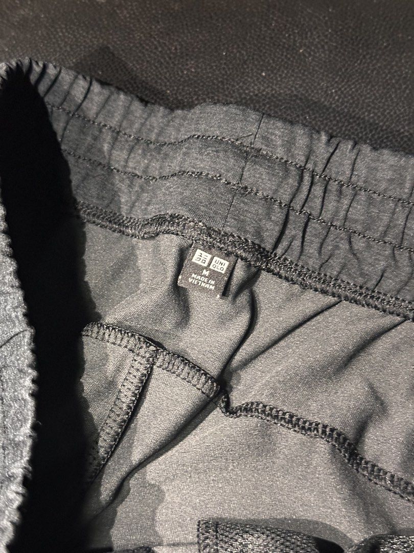 Uniqlo Dark Grey Drawstring Sweatpants Size M (Category: Joggers) located in Las Pinas. Submitted by boldbear_89ab40 (Listing ID 1470827054, Image 3). Description: - Brand: Uniqlo - Color: Dark Grey - Size: Men's Medium - Material: Soft jersey (Made in Vietnam) - Features: Elastic waistband with adjustable drawstring, two side pockets - Fit: Relaxed tapered fit - Condition: Clean, great pre-loved condition with no major flaws or stains - Ideal fo