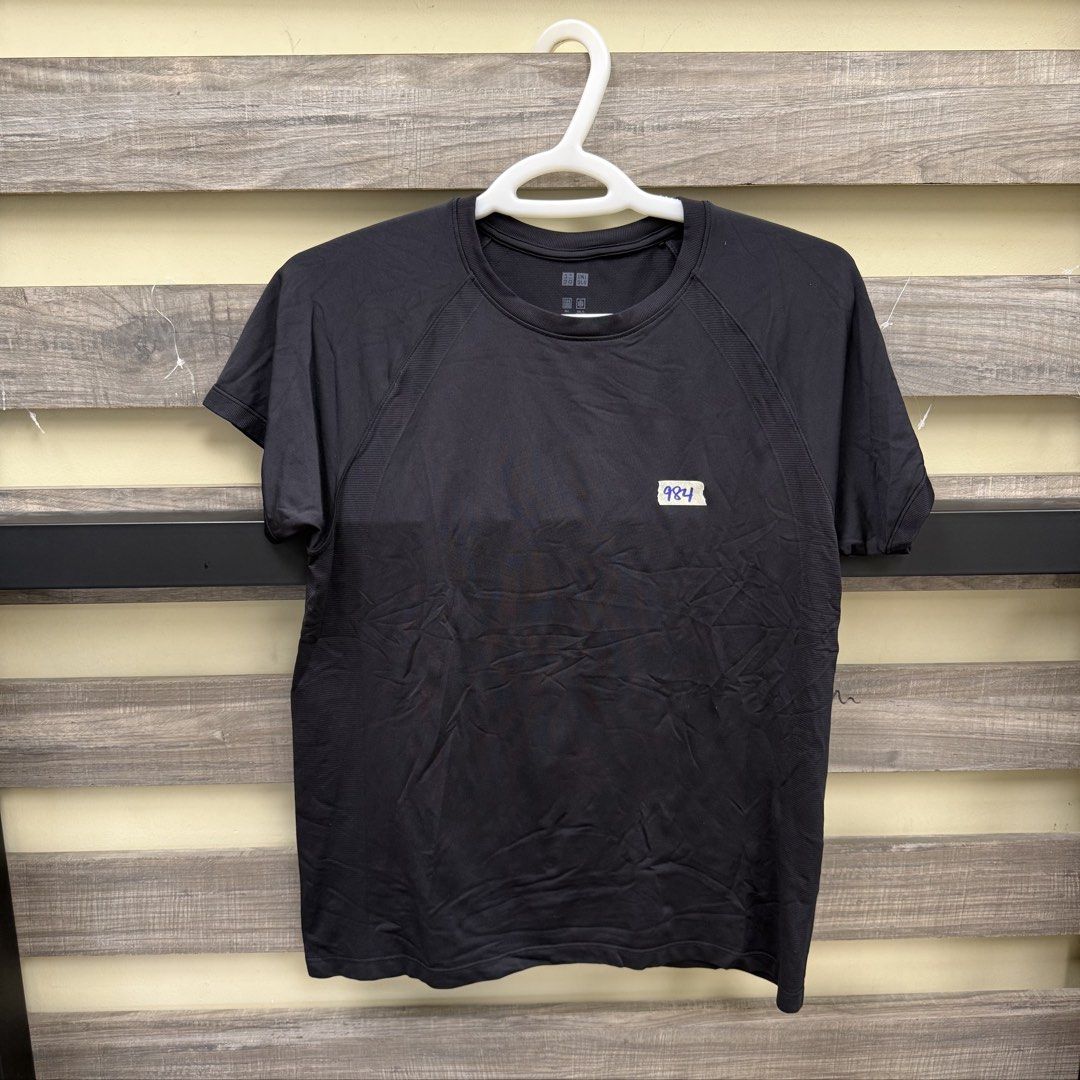 Uniqlo Dark Top (Category: Blouses) located in Mandaluyong City. Submitted by bestdressedph2025 (Listing ID 1470860477, Image 1). Description: MOP: GCash MOD: Lalamove/J&T LOCATION: Brgy. Addition Hills, Mandaluyong Discount avail for multiple items. Dimensions in Inches: Shoulder: 16 Bust: 18 Length: 23 Size on Tag: L PM for inquiries!.