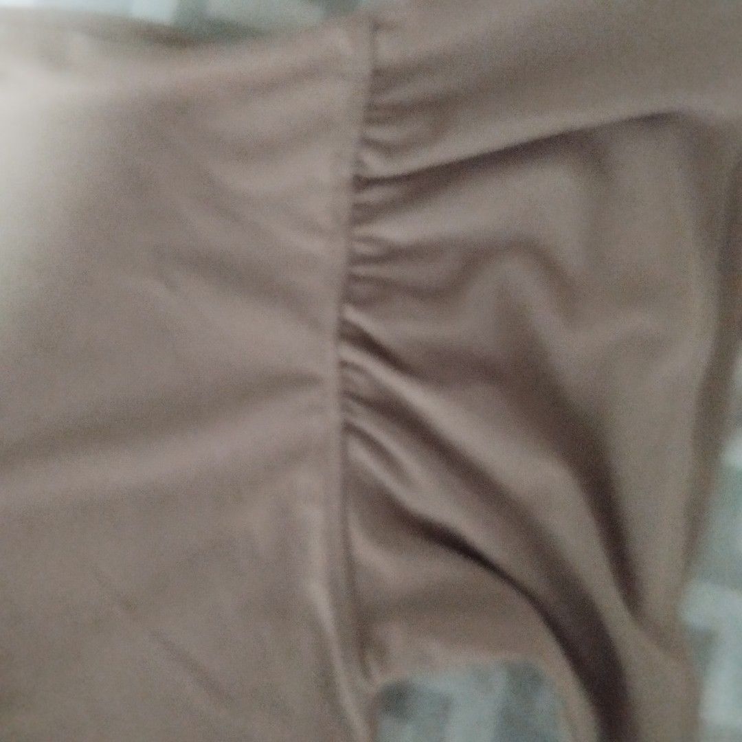 Uniqlo Pinkish Beige Polyester Blouse Size S (Category: Blouses) located in Manila. Submitted by lene48 (Listing ID 1470757901, Image 3). Description: - Brand: Uniqlo - Color: Pinkish beige - Size: S - Material: 100% polyester (lightweight and smooth drape) - Design: Crew neckline, short sleeves with gathered ruffled shoulders - Origin: Made in Indonesia - Condition: Clean inner tag with full care and sizing info attached.