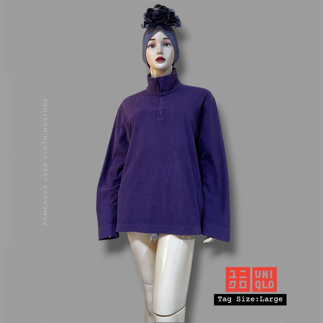 Uniqlo Purple Fleece Mock Neck Pullover Large (Category: Coats, Jackets and Outerwear) located in Naga. Submitted by 2ndusedclothingstore (Listing ID 1470856460, Image 1). Description: - Brand: Uniqlo - Item: Fleece pullover - Color: Deep violet / purple - Size: Large - Design: Mock neck with short front button placket - Fit: Relaxed - Material: Soft, warm fleece fabric - Condition: Excellent, clean look.