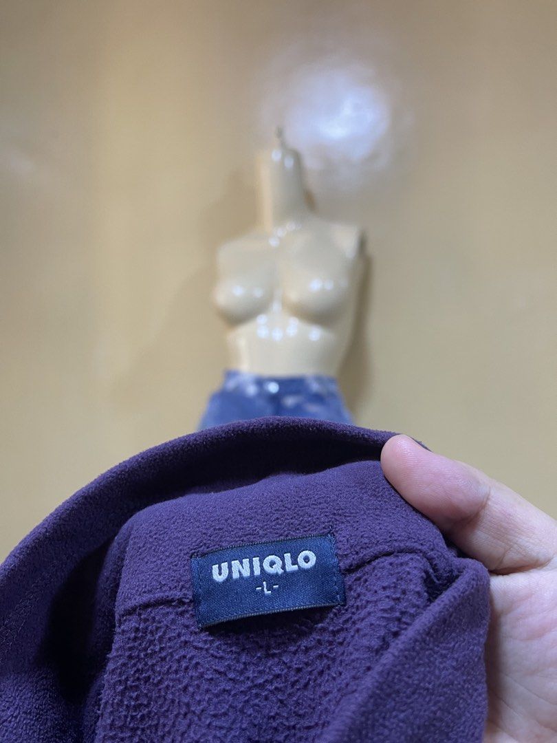 Uniqlo Purple Fleece Mock Neck Pullover Large (Category: Coats, Jackets and Outerwear) located in Naga. Submitted by 2ndusedclothingstore (Listing ID 1470856460, Image 2). Description: - Brand: Uniqlo - Item: Fleece pullover - Color: Deep violet / purple - Size: Large - Design: Mock neck with short front button placket - Fit: Relaxed - Material: Soft, warm fleece fabric - Condition: Excellent, clean look.