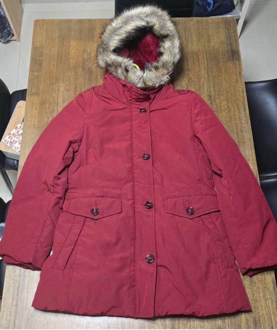 Uniqlo Ultra Warm Down Short Coat Red (Category: Coats, Jackets and Outerwear) located in Caloocan City. Submitted by conjestion (Listing ID 1470808401, Image 2). Description: - Brand: Uniqlo - Item: Ultra Warm Down Short Coat - Color: Red - Size: L (fits true to size) - Hood: Features removable faux fur trim - Lining: Fully lined with soft, cozy reddish faux fur inside - Closure: Front zipper and button closure - Pockets: Deep front pockets with