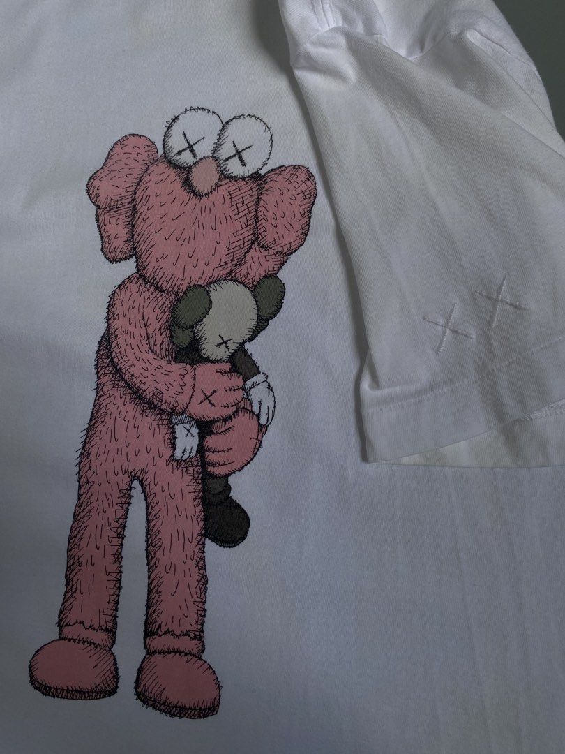 Uniqlo UT x KAWS White Tee Size S (Category: Shirts) located in Cavite. Submitted by awuuu27 (Listing ID 1470748191, Image 2). Description: UN!QL0 X K@WS €LM0 Tee 💎 DIMES: Width-19.5/Length-27(M) CONDITION: 9/10 COLOR RATE: 9/10 ISSUE: needwash .