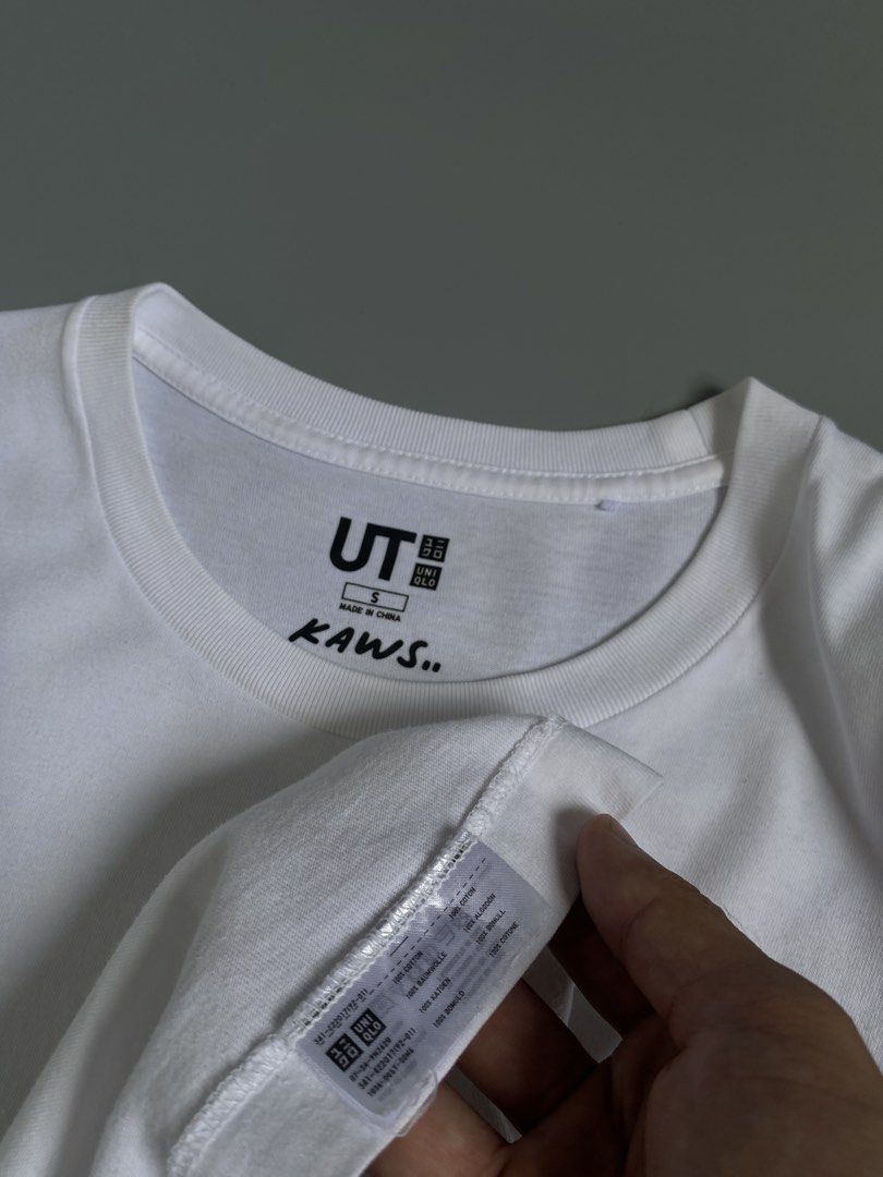 Uniqlo UT x KAWS White Tee Size S (Category: Shirts) located in Cavite. Submitted by awuuu27 (Listing ID 1470748191, Image 3). Description: UN!QL0 X K@WS €LM0 Tee 💎 DIMES: Width-19.5/Length-27(M) CONDITION: 9/10 COLOR RATE: 9/10 ISSUE: needwash .