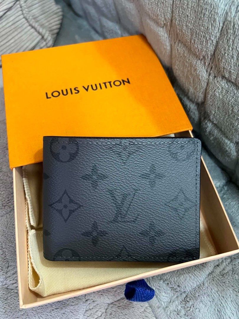 Unused Louis Vuitton Monogram Eclipse Slender Wallet (Category: Luxury Bags & Wallets) located in Quezon City. Submitted by hellopatchi (Listing ID 1470750911, Image 2). Description: Lv bifold wallet unused microchip With dustbag, box and paper bag Authentic Louis Vuitton Slender wallet - Monogram Eclipse canvas with black leather interior - Made in France stamp clearly visible - Multiple card slots for everyday essentials - Never used, pristine 