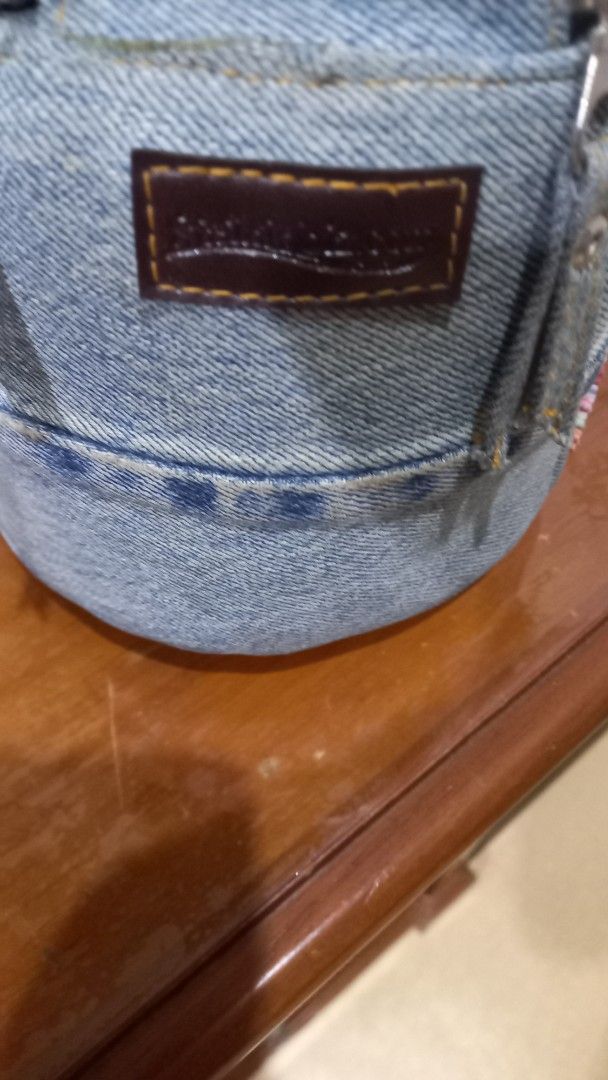 Upcycled Denim Handbag with Beaded Gem Embellishments (Category: Tote Bags) located in Manila. Submitted by miss66449 (Listing ID 1470837964, Image 3). Description: -Girly Style: Upcycled round denim handbag in a light blue wash - Accents: Colorful rhinestone butterflies and beaded flower - Details: Denim top handle, zip closure, black fabric lining, and one inner zip pocket - Origin: Made in Thailand label inside Rarely you can spot selling in m
