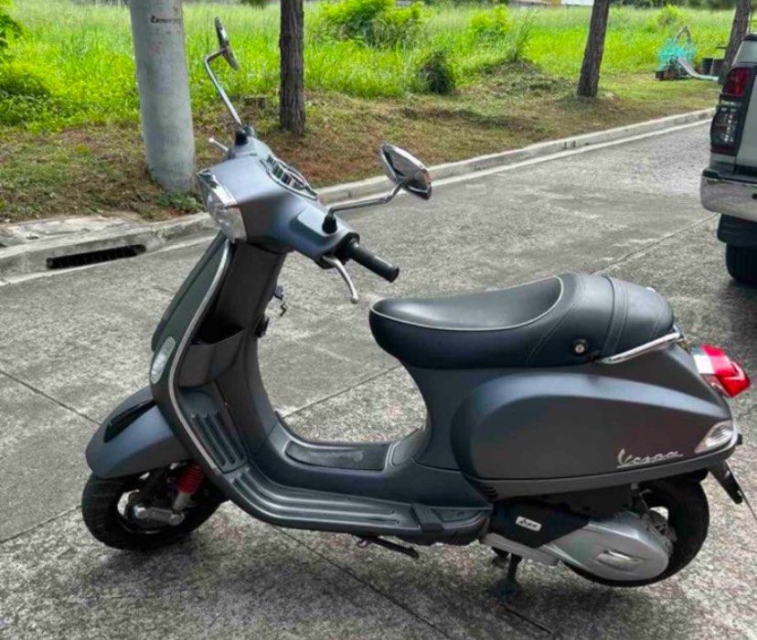 Vespa S Matt Grey Scooter (Category: Skates, Rollerblades & Scooters) located in Manila. Submitted by aaronalejandro16 (Listing ID 1470906001, Image 2). Description: - Model: Vespa S Scooter - Color: Matte Grey - Mileage: 5,212 km - Design: Classic rectangular headlight, black alloy wheels, and comfortable black seat with white piping - Condition: Clean body, runs smoothly - Usage: Ideal for daily city commutes or weekend leisure rides.