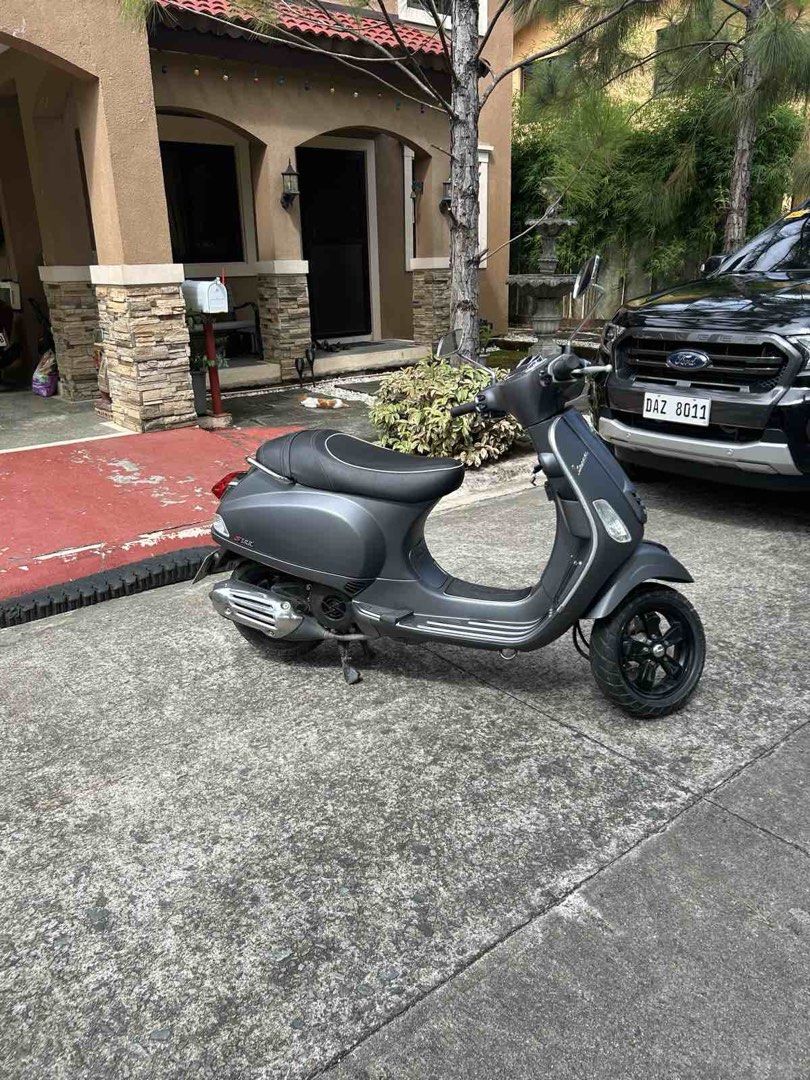 Vespa S Matt Grey Scooter (Category: Skates, Rollerblades & Scooters) located in Manila. Submitted by aaronalejandro16 (Listing ID 1470906001, Image 3). Description: - Model: Vespa S Scooter - Color: Matte Grey - Mileage: 5,212 km - Design: Classic rectangular headlight, black alloy wheels, and comfortable black seat with white piping - Condition: Clean body, runs smoothly - Usage: Ideal for daily city commutes or weekend leisure rides.